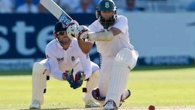 Hashim Amla sweeps on his way to an unbeaten half-century against England yesterday. Tom Hevezi / AP Photo