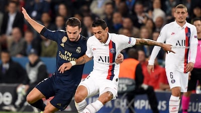 Paris Saint-Germain's Argentine midfielder Angel Di Maria vies Real Madrid's Spanish defender Dani Carvajal. AFP