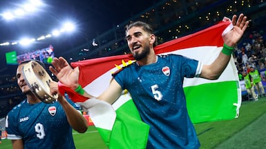 Soccer Football - FIFA World Cup - Inter-Confederation Playoffs - Final - Iraq v Bolivia - Estadio Monterrey, Monterrey, Mexico - March 31, 2026 Iraq's Ali Al-Hamadi and Frans Putros celebrate with the flag of Kurdistan after qualifying for FIFA World Cup REUTERS / Raquel Cunha