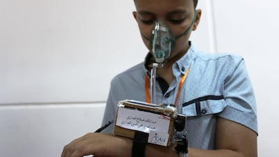 A student wears a student-made 'smart watch', which measures the temperature and blood pressure of its users, in the city of Zliten, Libya. Reuters