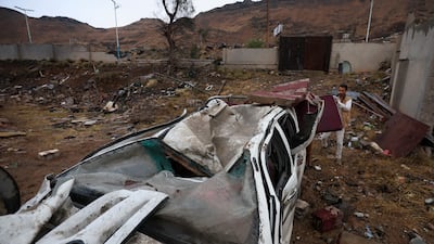 A damaged vehicle at the site of an alleged Saudi-led coalition air strike on a house in Sanaa, Yemen, on Saturday. EPA