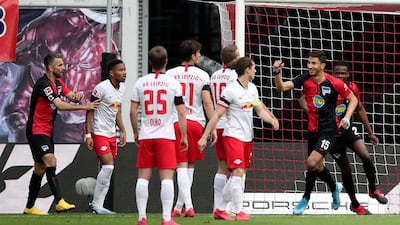Hertha Berlin midfielder Marko Grujic, right, celebrates scoring the opening goal. AFP