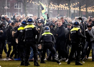 Anti-lockdown protesters face off with Dutch police in Museumplein, Amsterdam, in January. AFP