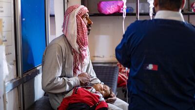 A child suffering from cholera receives treatment at Al Kasrah hospital in Syria's eastern province of Deir Ezzor. AFP