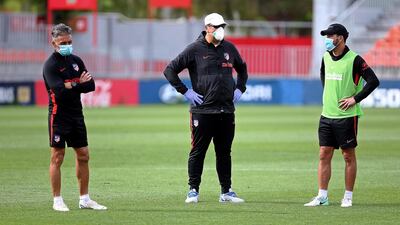 Atletico Madrid head coach Diego Simeone and assistant coaches German Burgos and Nelson Vivas.