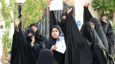 Supporters of Bahraini opposition Haq Movement spokesman, Abduljalil al Singace, protest near his home after his detention.