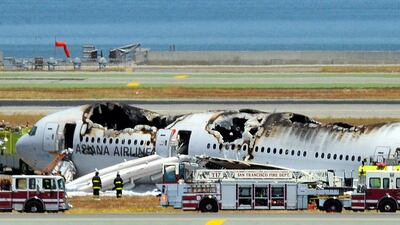 The Asiana Airlines Boeing 777 is seen on the runway at San Francisco International Airport after crash landing. Topshots/AFP Photo/Josh Edelson.