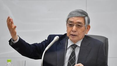 Haruhiko Kuroda, governor of the Bank of Japan, speaks at the central bank's headquarters in Tokyo on Friday. The Bank of Japan surprised investors by joining other central banks with a measure to combat climate change. Photo: Bloomberg