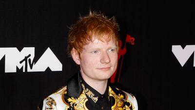 British singer Ed Sheeran, in Versace, arrives on the MTV Video Music Awards red carpet.