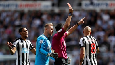 Referee Andre Marriner shows Newcastle United’s Jonjo Shelvey, right, a red card for a stamp on Tottenham's Dele Alli. Lee Smith / Reuters