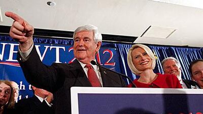 With wife Callista by his side, the Republican politician Newt Gingrich addresses supporters at an election night rally in Columbia, South Carolina on Saturday.