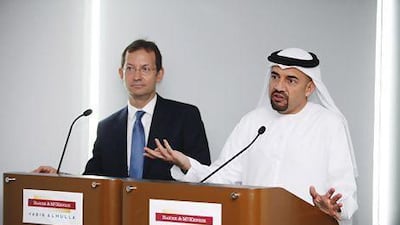 Borys Dackiw, left, the managing partner of Baker & McKenzie in the Gulf region and Habib Al Mulla, announce the merger of the law firms in Dubai yesterday. Sarah Dea / The National