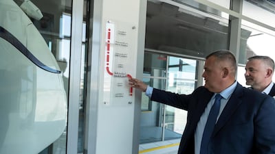 Oleg Zaretskiy examines the uCar pod terminal. Developers predict that they will be able to achieve a speed of 150kph, and later up to 500kph through super-strong string-rail technology.