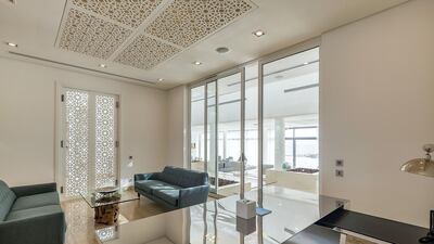 White walls and a dash of colour from the furniture is the general look.