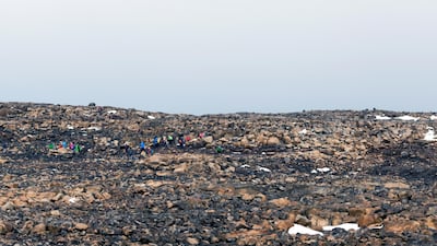 Hikers makes their way to where Okjokull glacier will be commemorated after it was lost to climate change, in in west-central Iceland. EPA