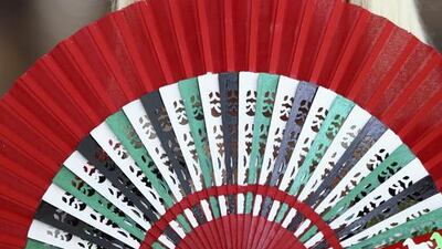 Racegoers enjoys the festivities before the start of the Dubai World Cup. Francois Nel / Getty Images