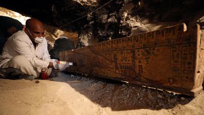 An antiquities worker brushes a coffin in the recently discovered tomb of Amenemhat, a goldsmith from the New Kingdom near the Nile city of Luxor, Egypt. Mohamed Abd El Ghany / Reuters