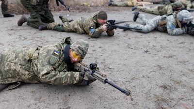 Alisa, 38, a media relations specialist, takes part in a combat skills training for civilians near Kiev. Reuters