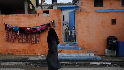 But now, overlooking the sewage-contaminated Mediterranean beachfront, the camp’s houses are covered in vibrant colours.