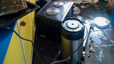 Debris lies strewn across the floor in the kitchen of Renagi Ravu's house in Kainantu, following Sunday's quake.