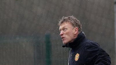 Manchester United's manager David Moyes heads a ball during a training session at the club's Carrington training complex in Manchester, on Tuesday before United play Olympiakos on Wednesday. Phil Noble / Reuters / March 18, 2014