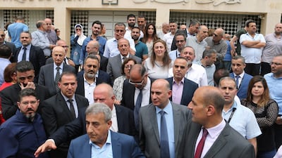 Employees of the Lebanese central bank gather during a strike over state budget proposals that would cut their benefits, in front of the central bank in Beirut, Lebanon May 6, 2019. Reuters