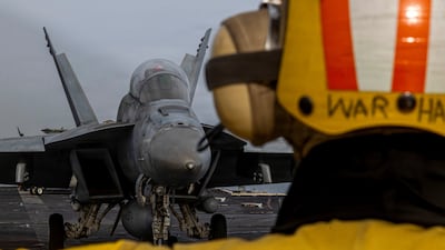A fighter jet prepares to launch from the flight deck of the US aircraft carrier USS Abraham Lincoln. Reuters