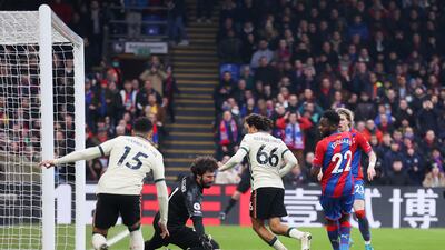 Liverpool keeper Alisson Becker saves Odsonne Edouard's back-heeled effort for Crystal Palace. Getty