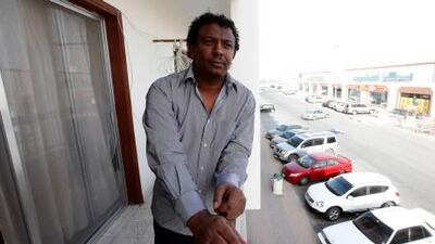 Muammar Gaddafi, who wants to legally change his name, poses at his home Fujairah.