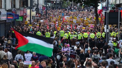 A Palestinian flag is waved during an anti-racism rally assembled to counter an anti-immigration protest in Walthamstow, London. Getty Images