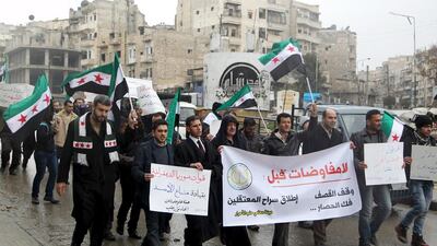 A protest march in Aleppo yesterday demanded the release of prisoners held in Assad regime jails, an end to shelling and lifting the siege of besieged areas. Abdalrhman Ismail / Reuters