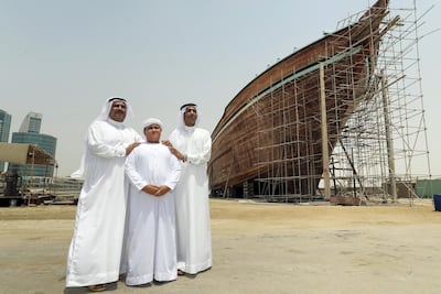 Dubai, United Arab Emirates - July 4th, 2018: L-R Majid Obeid Bin Suloom Al Falasi, with son Obaid Majid Obaid Bin Majid Al Falasi and brother Ahmed Al Falasi. Dhow building company on the Dubai Creek. Wednesday, July 4th, 2018 at The Creek, Dubai. Chris Whiteoak / The National