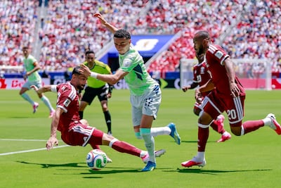 Switzerland's Ruben Vargas, centre, in action against Qatar's Yusuf Abdurisag, left, and Ahmed Fathy. EPA
