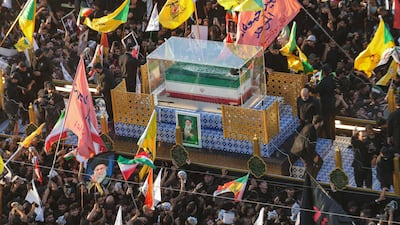 A crowd surrounds the convoy carrying the coffin of the Ayatollah in Najaf, Iraq. AFP