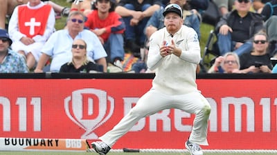 New Zealand fielder Glenn Phillips dismisses England batsman Gus Atkinson with a catch during the third day of the first Test match at Hagley Oval in Christchurch on Saturday November 30. AFP