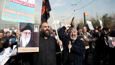 Demonstrators react during a protest against the assassination of Suleimani and Iraqi militia commander Abu Mahdi al-Muhandis in Tehran. Reuters