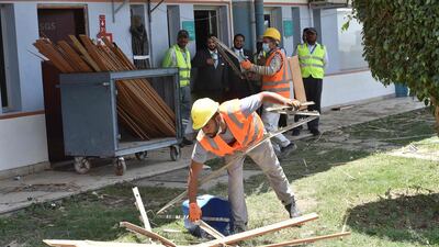 Workers fixing the damage at Abha airport in the southwest of Saudi Arabia. AFP