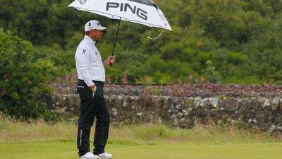 Lee Westwood of England uses an umbrella to shelter from the rain on the 11th green during the second round on day two of the 145th Open Championship at Royal Troon on July 15, 2016 in Troon, Scotland. (Photo by Kevin C. Cox/Getty Images)