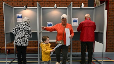 A Dutch woman casts her vote in the European Union elections at a polling station in Baarle-Nassau, in the southern Netherlands. AFP