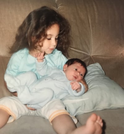 Issa, above at the age of about four, with her baby sister Aleah at the old 'Billy Banks' High View flats, Penarth, circa 1989. Photo: Hanan Issa