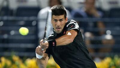 Roger Federer, next slide, has lost more to Novak Djokovic recently but is tied 1-1 in head-to-head at the Dubai Duty Free Tennis Championships. Pawan Singh / The National; Ahmed Jadallah / Reuters