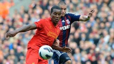 The progress Andre Wisdom, left, has made at Liverpool has brought him international recognition. Paul Ellis / AFP