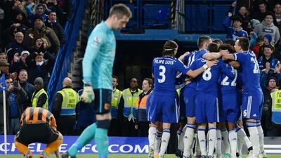 Chelsea players celebrate their second goal in a 2-0 win against Hull City on Saturday in the Premier League at Stamford Bridge. Andy Rain / EPA