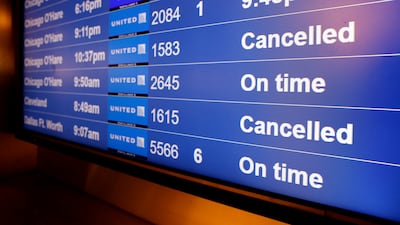 A screen at the San Francisco International Airport shows cancelled United Airlines flights to Chicago O'Hare and Cleveland on Christmas Eve. EPA