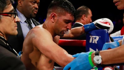 Amir Khan looks dejected after losing the fight. Action Images via Reuters