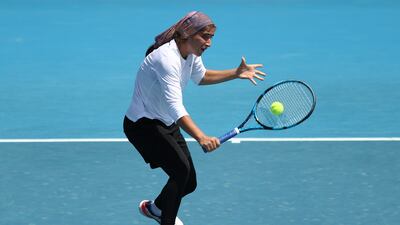 Meshkatolzahra Safi plays a backhand volley to Anja Nayar. Getty Images