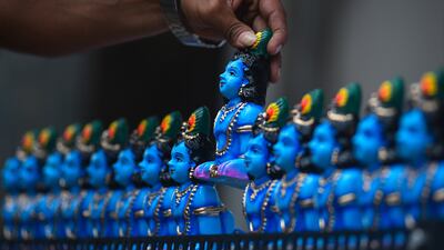 A vendor arranges idols of Krishna in Chennai. EPA