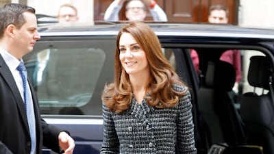 The Duchess of Cambridge wears a black, white and blue Dolce & Gabbana boucle tweed suit, as she arrives at a Mental Health In Education conference in London on February 13. The suit is accessorised with Tod's suede pumps, a Mulberry suede Bayswater clutch and Kiki McDonough earrings. Reuters