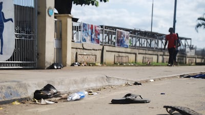 Footwear litters the street following a crush at a food charity event in Port Harcourt, Nigeria. AP