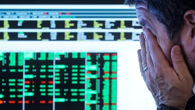 A trader at the New York Stock Exchange. US stock markets have had their worst six months in more than 50 years. Reuters